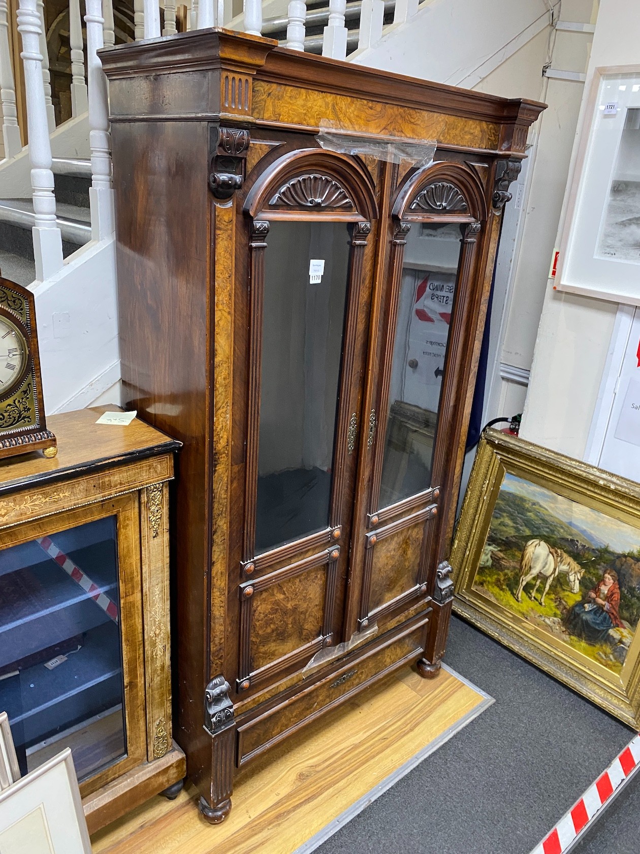 A 19th century French figured walnut glazed two door cabinet, width 101cm, depth 46cm, height 185cm